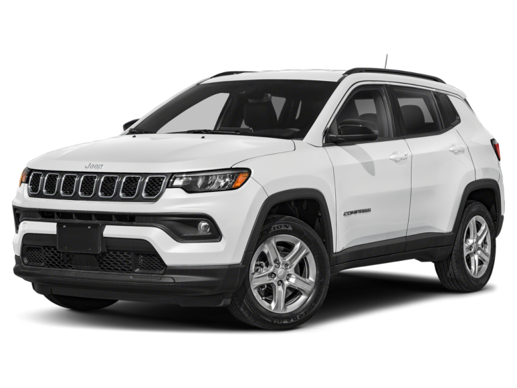 A white Jeep Compass displayed at a three-quarter front angle. The SUV features a black grille with the signature seven-slot design, silver wheels, black lower body trim, and tinted windows. It is shown on a plain white background with a soft shadow beneath it.